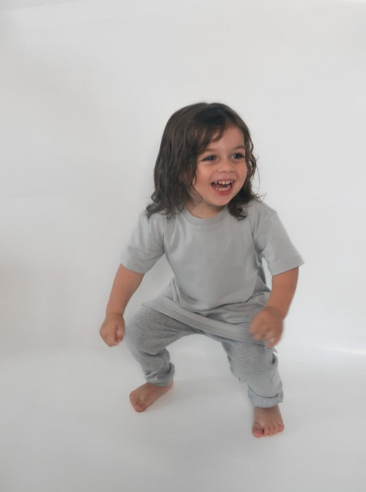 Boy wearing Grey t-shirt and grey loose leggings