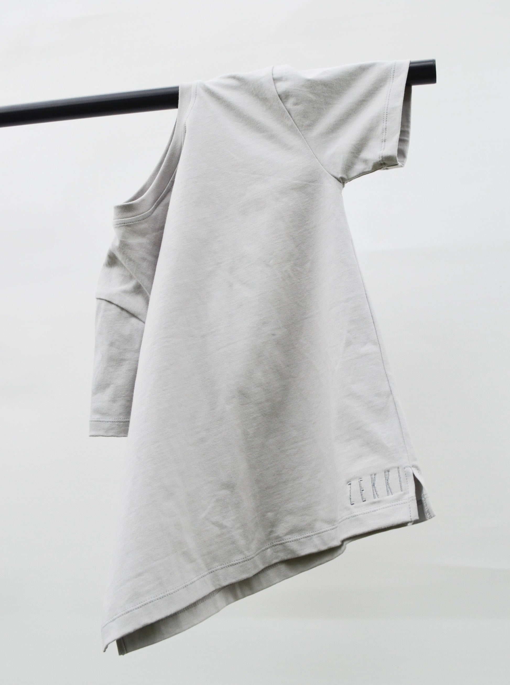 grey colour t-shirt hanging over pole