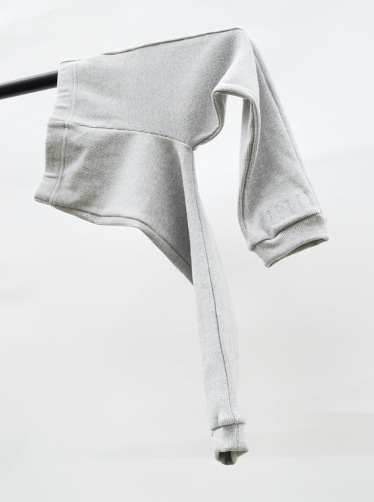 Grey casual pants hanging over pole